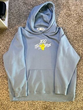 100 Thieves Men’s Light Blue Graphic Hoodie